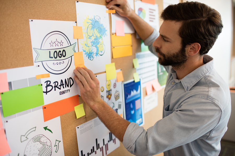 Side view of businessman analyzing chart in office